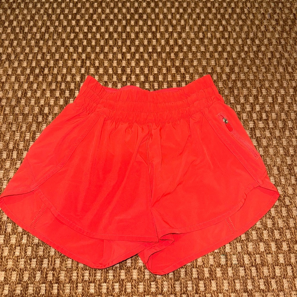Lululemon High Waisted Shorts 3”. Orange color